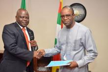 Dr. Emmanuel Ibe Kachikwu (R), the new managing director of the Nigerian National Petroleum Corp (NNPC), shakes hands with the former Group Managing Director of NNPC, Dr. Joseph Thlama Dawha during a handover ceremony in Abuja, Nigeria, August 5, 2015. PHOTO BY REUTERS/NNPC