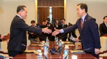 South Korean Unification Minister Cho Myoung-gyon shakes hands with his North Korean counterpart Ri Son Gwon during their meeting at the truce village of Panmunjom, South Korea, June 1, 2018. PHOTO BY REUTERS/Yonhap 