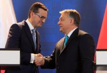 Polish Prime Minister Mateusz Morawiecki and Hungarian Prime Minister Viktor Orban shake hands during a joint news conference in Budapest, Hungary, January 3, 2018. PHOTO BY REUTERS/Bernadett Szabo