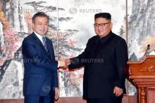 South Korean President Moon Jae-in shakes hands with North Korean leader Kim Jong Un during a joint news conference in Pyongyang, North Korea, September 19, 2018. PHOTO BY REUTERS/Pyeongyang Press Corps/Pool 
