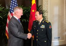 U.S. Defense Secretary Jim Mattis and China's Defense Minister Wei Fenghe greet each other ahead of talks in Singapore, October 18, 2018. PHOTO BY REUTERS/Phil Stew