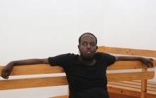 Hassan Hanafi, a former media officer for the Somali Islamist group al Shabaab, sits inside the dock at the courthouse in the capital Mogadishu, March 3, 2016. PHOTO BY REUTERS/Feisal Omar