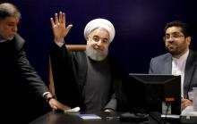 Iranian President Hassan Rouhani (C) waves after he registered for February's election of the Assembly of Experts, the clerical body that chooses the supreme leader, at the Interior Ministry in Tehran, December 21, 2015. PHOTO BY REUTERS/Raheb Homavandi