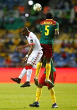 Cameroon's Michael Ngadeu Ngadjui and Burkina Faso's Niguimbe Nakoulma. PHOTO BY REUTERS/Mike Hutchings