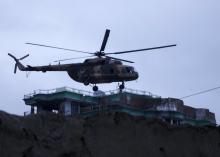 An Afghan National Army (ANA) helicopter drops commandos on the roof of a building during an operation near the Indian consulate in Mazar-i-Sharif, Afghanistan, January 4, 2016. PHOTO BY REUTERS/Anil Usyan