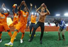 Ivory Coast's head coach Herve Renard (2nd R) of France celebrates and dances with his players after winning the African Nations Cup final soccer match against Ghana in Bata, February 8, 2015. PHOTO BY REUTERS/Amr Abdallah Dalsh