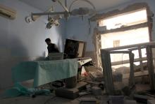 A medic inspects the damage inside Anadan Hospital, sponsored by Union of Medical Care and Relief Organizations (UOSSM), after it was hit yesterday by an airstrike in the rebel held city of Anadan, northern Aleppo province, Syria, July 31, 2016. PHOTO BY REUTERS/Ammar Abdullah