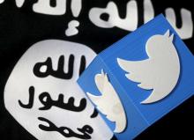 A 3D printed logo of Twitter and an Islamic State flag,February 18, 2016. PHOTO BY REUTERS/Dado Ruvic