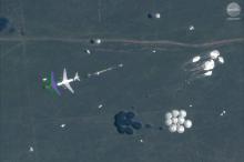A satellite image shows an airborne paradrop in progress during the Russian military exercise known as Vostok 2018, conducted at the Tsugol training area in eastern Russia, September 13, 2018. PHOTO BY REUTERS/Satellite image ©2018 DigitalGlobe, a Maxar company