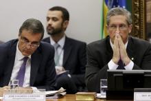 Brazil's General Attorney Jose Eduardo Cardozo (L) and congressman Rogerio Rosso react during a session of the impeachment committee against Brazilian President Dilma Rousseff in Brasilia, Brazil, April 11, 2016. PHOTO BY REUTERS/Ueslei Marcelino