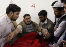 Relatives and friends surround a man injured in a militant attack at Bacha Khan University, at a hospital in Charsadda, Pakistan, January 20, 2016. PHOTO BY REUTERS/Khuram Parvez