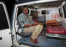Somali men injured in a night car bomb attack near a hotel in Hamarweyne district wait in an ambulance near the scene in capital Mogadishu, Somalia, February 26, 2016. PHOTO BY REUTERS/Feisal Omar