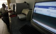 A man sits in an internet cafe in Cairo, May 18, 2010. PHOTO BY REUTERS/Amr Abdallah Dalsh