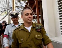 Israeli soldier Elor Azaria (R), convicted of manslaughter, arrives to a military court where arguments for his sentencing will be heard in Tel Aviv, January 24, 2017. PHOTO BY REUTERS/Debbie Hill
