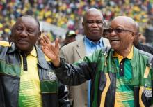 South African President Jacob Zuma (R) and Deputy President Cyril Ramaphosa wave to supporters at a rally to commemorate the 105th birthday of the ruling African National Congress (ANC), in Soweto, South Africa, January 8, 2017. PHOTO BY REUTERS/James Oatway