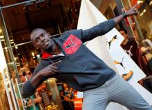Jamaica's double Olympic champion sprinter Usain Bolt strikes a pose while inaugurating a Puma store in Barcelona