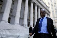 John Ashe, a former United Nations General Assembly president and U.N. ambassador from Antigua and Barbuda, exits the Manhattan U.S. District Courthouse in New York, December 10, 2015. PHOTO BY REUTERS/Brendan McDermid
