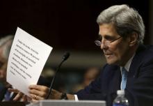 U.S. Secretary of State John Kerry checks his opening remarks before appearing at the Senate Foreign Relations Committee in Washington July 23, 2015. REUTERS/Gary Cameron