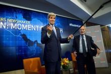 U.S. Secretary of State John Kerry acknowledges attendees with Reuters Editor-at-Large Harold Evans (R) during a Reuters Newsmaker event on the nuclear agreement with Iran, in New York, August 11, 2015. PHOTO BY REUTERS/Brendan McDermid