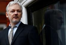 WikiLeaks founder Julian Assange makes a speech from the balcony of the Ecuadorian Embassy, in central London, Britain, February 5, 2016. PHOTO BY REUTERS/Peter Nicholls