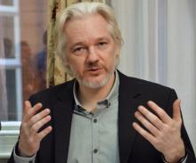 WikiLeaks founder Julian Assange gestures during a news conference at the Ecuadorian embassy in central London August 18, 2014 file photo. PHOTO BY REUTERS/John Stillwell