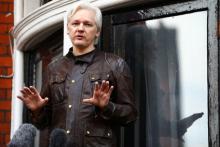 WikiLeaks founder Julian Assange is seen on the balcony of the Ecuadorian Embassy in London, Britain, May 19, 2017. PHOTO BY REUTERS/Neil Hall