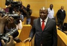 Julius Malema, expelled African National Congress (ANC) youth leader and current leader of the Economic Freedom Fighters (EFF) political party, gestures at Polokwane High Court, where he appeared on charges of money laundering and racketeering, November 18, 2013. PHOTO BY REUTERS/Siphiwe Sibeko