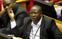 Opposition Economic Freedom Fighters leader Julius Malema reacts as South Africa's President Jacob Zuma answers questions in parliament in Cape Town, August 6, 2015. PHOTO BY REUTERS/Mike Hutchings