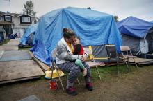 Kadee Ingram, 28, holds her son Sean, 2, at SHARE/WHEEL Tent City 3 outside Seattle, Washington, October 13, 2015. PHOTO BY REUTERS/Shannon Stapleton