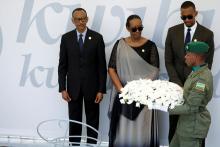 Rwandan President Paul Kagame, Jeannette Kagame and their oldest son Ivan Cyomoro Kagame attend a wreath laying ceremony during the commemoration of the 25th anniversary of the genocide at the Genocide Memorial in Gisozi in Kigali, Rwanda, April 7, 2019. PHOTO BY REUTERS/Baz Ratner