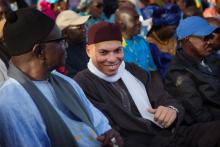 Karim Wade (C), son of Senegal's former president Abdoulaye Wade, attends a rally by his father's political party Parti Democratique Senegalais (PDS) in Dakar, December 6, 2012. PHOTO BY REUTERS/Joe Penney