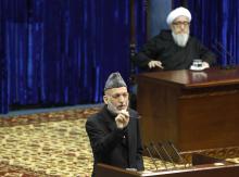 Afghan President Hamid Karzai speaks during the opening of the Loya Jirga, or grand council, in Kabul