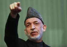 Afghan President Hamid Karzai speaks during a news conference in Kabul