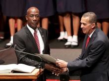 Keith Rowley (L) and President of Trinidad and Tobago Anthony Carmona shake hands during Rowley's swear-in ceremony as prime minister of Trinidad and Tobago in Port-of-Spain, September 9, 2015. PHOTO BY REUTERS/Andrea De Silva