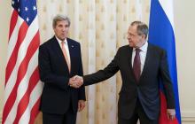 Russian Foreign Minister Sergei Lavrov (R) shakes hands with U.S. Secretary of State John Kerry during a meeting in Moscow, Russia, March 24, 2016. PHOTO BY REUTERS/Maxim Zmeyev
