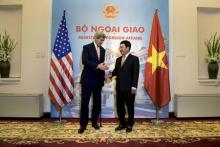 U.S. Secretary of State John Kerry (L) and Vietnam's Foreign Minister Pham Binh Minh shake hands before a meeting at the Ministry of Foreign Affairs in Hanoi, Vietnam, August 7, 2015. PHOTO BY REUTERS/Brendan Smialowski