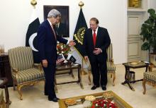 U.S. Secretary of State John Kerry (L) gestures to Pakistan Prime Minister Nawaz Sharif shortly after arriving in Islamabad, Pakistan, January 12, 2015. PHOTO BY REUTERS/Rick Wilking
