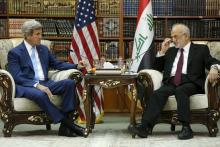 Iraq's Foreign Minister Ibrahim al-Jaafari (R) receives U.S. Secretary of State John Kerry in the library at the foreign minister's villa in Baghdad, April 8, 2016. PHOTO BY REUTERS/Jonathan Ernst