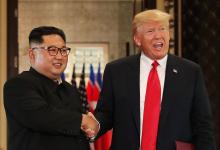 U.S. President Donald Trump and North Korea's leader Kim Jong Un shake hands after signing documents during a summit at the Capella Hotel on the resort island of Sentosa, Singapore, June 12, 2018. PHOTO BY REUTERS/Jonathan Ernst