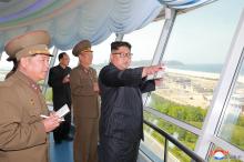 North Korean leader Kim Jong Un inspects the construction site of the Wonsan-Kalma coastal tourist area as Kim Su-gil (3rd L), newly appointed director of the General Political Bureau of the Korean People's Army, looks on, in this undated photo released by North Korea's Korean Central News Agency (KCNA) in Pyongyang. PHOTO BY REUTERS/KCNA