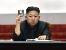 North Korean leader Kim Jong-Un holds up his ballot during the fifth session of the 12th Supreme People's Assembly of North Korea at the Mansudae Assembly Hall in Pyongyang in this April 13, 2012 file photo released by the North's KCNA on