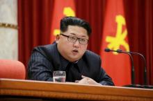 North Korean leader Kim Jong Un speaks during a ceremony to award party and state commendations to nuclear scientists, technicians, soldier-builders, workers and officials for their contribution, January 13, 2016. PHOTO BY REUTERS/KCNA