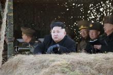 North Korean leader Kim Jong Un (front) watches a drill by the Korean People's Army (KPA) for hitting enemy naval target at undisclosed location in this undated photo released by North Korea's Korean Central News Agency (KCNA) in Pyongyang, January 31, 2015. PHOTO BY REUTERS/KCNA