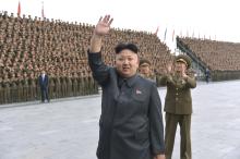 North Korean leader Kim Jong Un attends a photo session with KPA Unit 267 soldiers, who performed labour to remodel the Songdowon International Children's camp