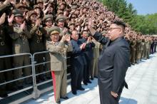 North Korean leader Kim Jong Un waves to North Korean scientists and technicians, who developed missile "Hwasong-12" in this undated photo released by North Korea's Korean Central News Agency (KCNA), May 20, 2017. PHOTO BY REUTERS/KCNA