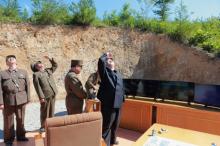 North Korean leader Kim Jong Un looks on during the test-launch of the intercontinental ballistic missile Hwasong-14 in this undated photo released by North Korea's Korean Central News Agency (KCNA) in Pyongyang July 5, 2017. PHOTO BY REUTERS/KCNA