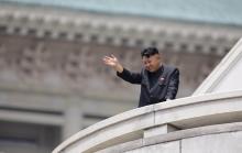 North Korean leader Kim Jong-un waves to the people during a parade to commemorate the 60th anniversary of the signing of a truce in the 1950-1953 Korean War, at Kim Il-sung Square in Pyongyang, July 27, 2013. PHOTO BY REUTERS/Jason Lee