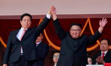 North Korean leader Kim Jong Un and China's Li Zhanshu, chairman of the Standing Committee of the National People's Congress (NPC), wave to people while attending a military parade marking the 70th anniversary of North Korea's foundation in Pyongyang, North Korea, September 9, 2018. PHOTO BY REUTERS/Danish Siddiqui
