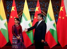Myanmar State Counsellor Aung San Suu Kyi (L) and Chinese Premier Xi Jinping (R) wait for Myanmar delegates to arrive for a meeting at the Diaoyutai State Guesthouse in Beijing, China, August 19, 2016. PHOTO BY REUTERS/Rolex Dela Pena