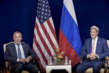 Russia's Foreign Minister Sergei Lavrov (L) and U.S. Secretary of State John Kerry sit next to each other before a bilateral meeting in Kuala Lumpur, Malaysia, August 5, 2015. PHOTO BY REUTERS/Brendan Smialowski